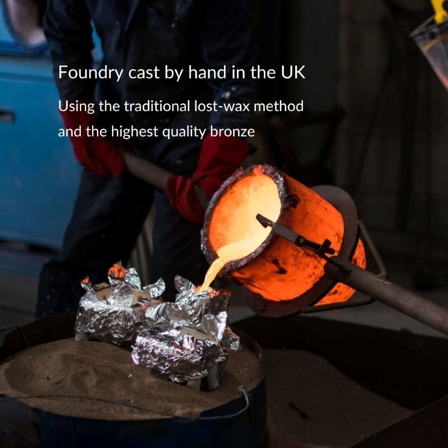 Foundry worker pouring molten bronze into a mold for the Sleepy Bronze Fox Sculpture