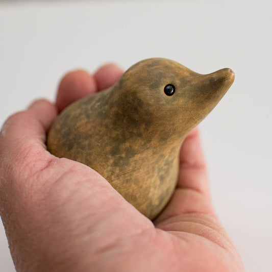 Small ceramic Shrew sculpture in a hand