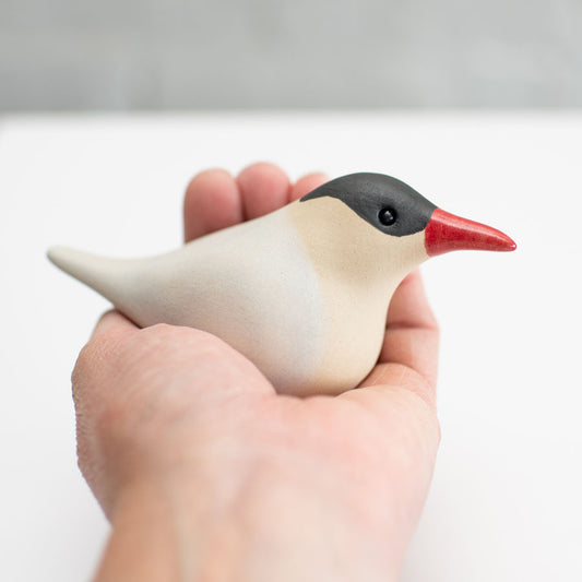 Arctic Tern - small ceramic sculpture in a hand