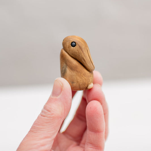 Small Ceramic Hare & Leveret Sculpture held in a hand