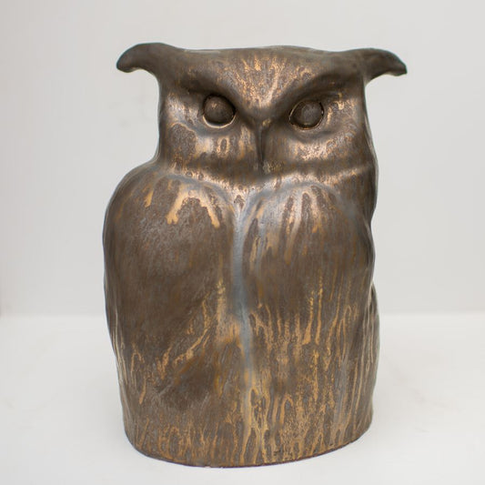 ceramic sculpture of an Eagle Owl in a golden metallic glaze