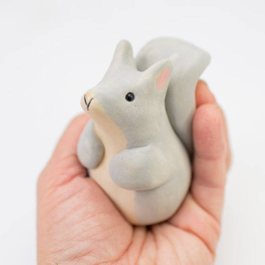 Small Grey Ceramic Squirrel held in a hand