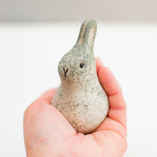 Curious Baby Bunny Ceramic held in a person's palm