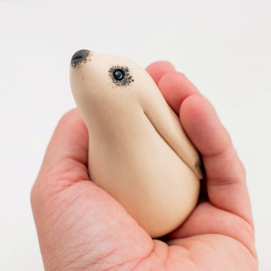 Ceramic Moongazing White Hare held in a hand