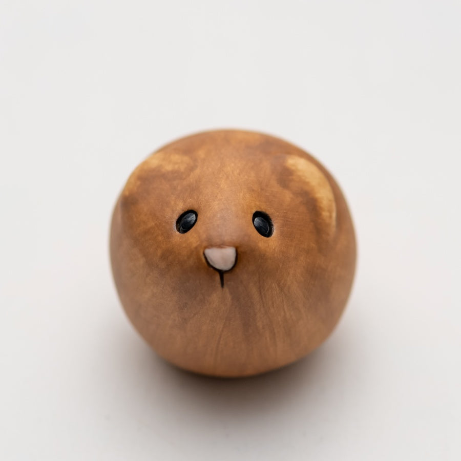 Brown Ceramic Vole sculpture on a white backgroud