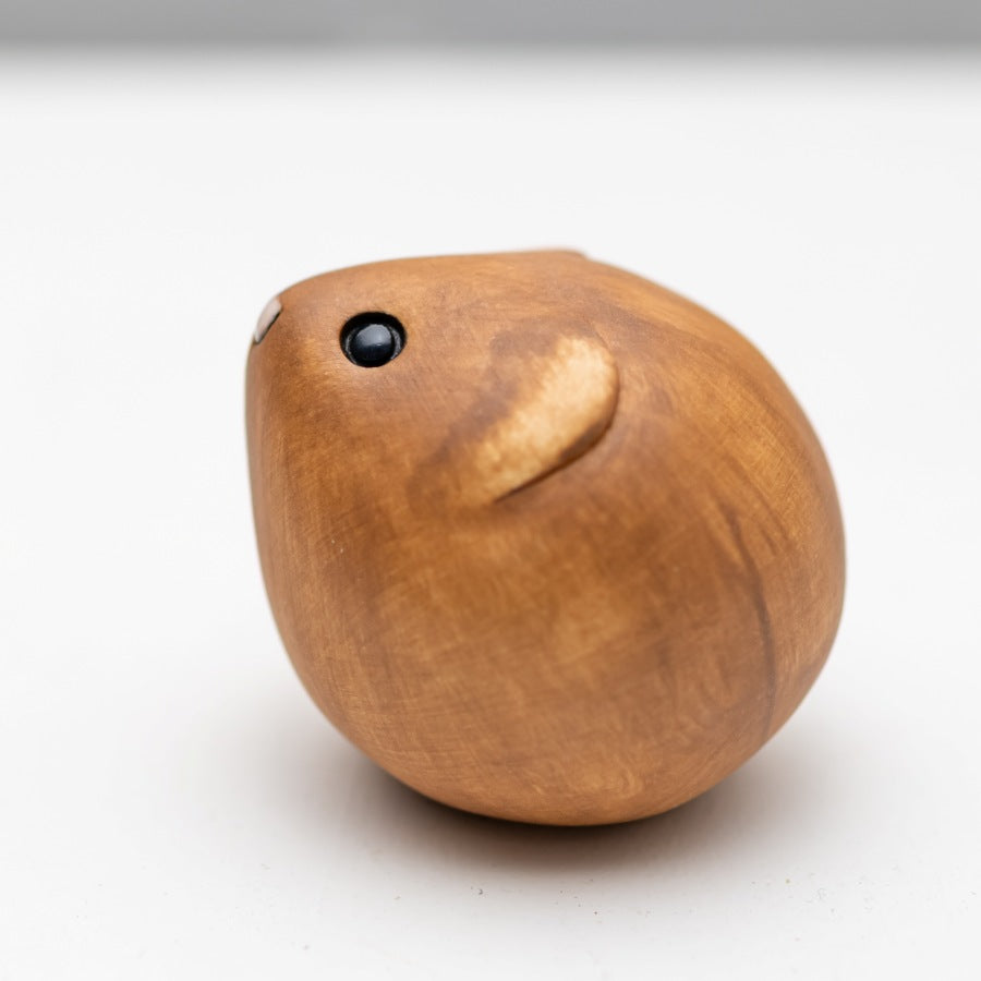Brown Ceramic Vole sculpture on a white backgroud