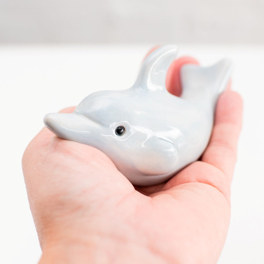 Small ceramic dolphin sculpture