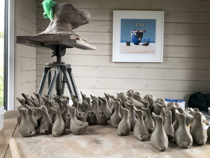 Loads of small ceramic ducks 
