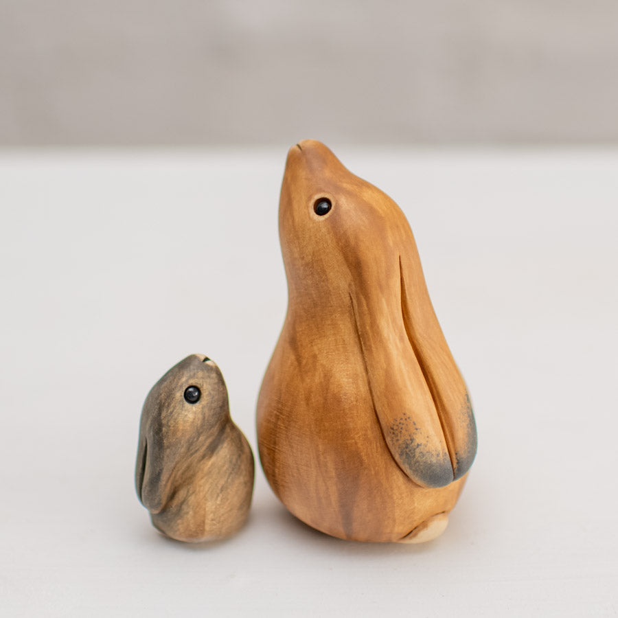 Hare sculpture - a brown hare and leveret sculpture on a plain white background