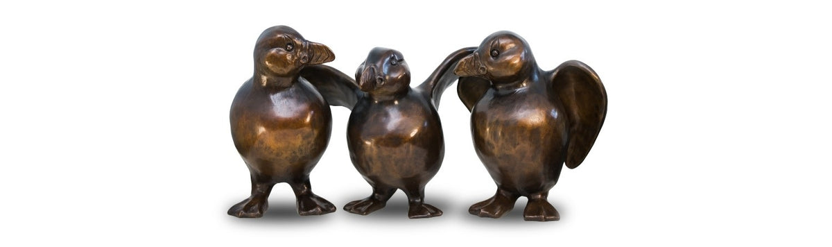 Three Bronze Puffin Sculptures