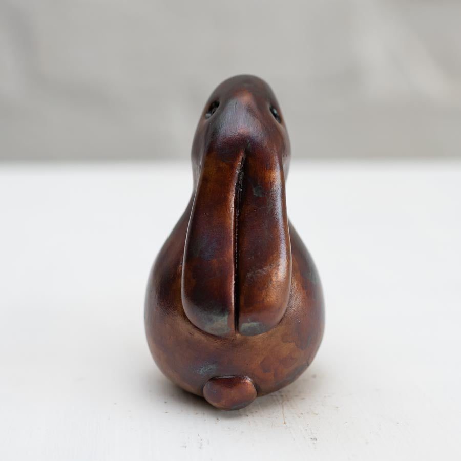 Small Brown Foundry Bronze Bunny Rabbit Sculpture against a white background - rear view