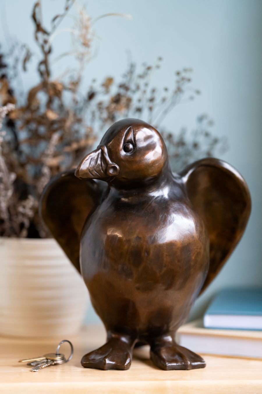 Bronze Puffin Sculpture - Arthur Flap, with keys and books