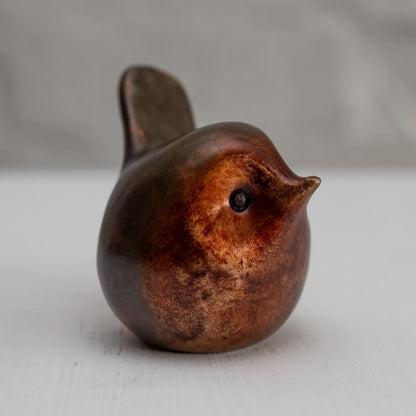 Small Bronze Robin Sculpture on a white background