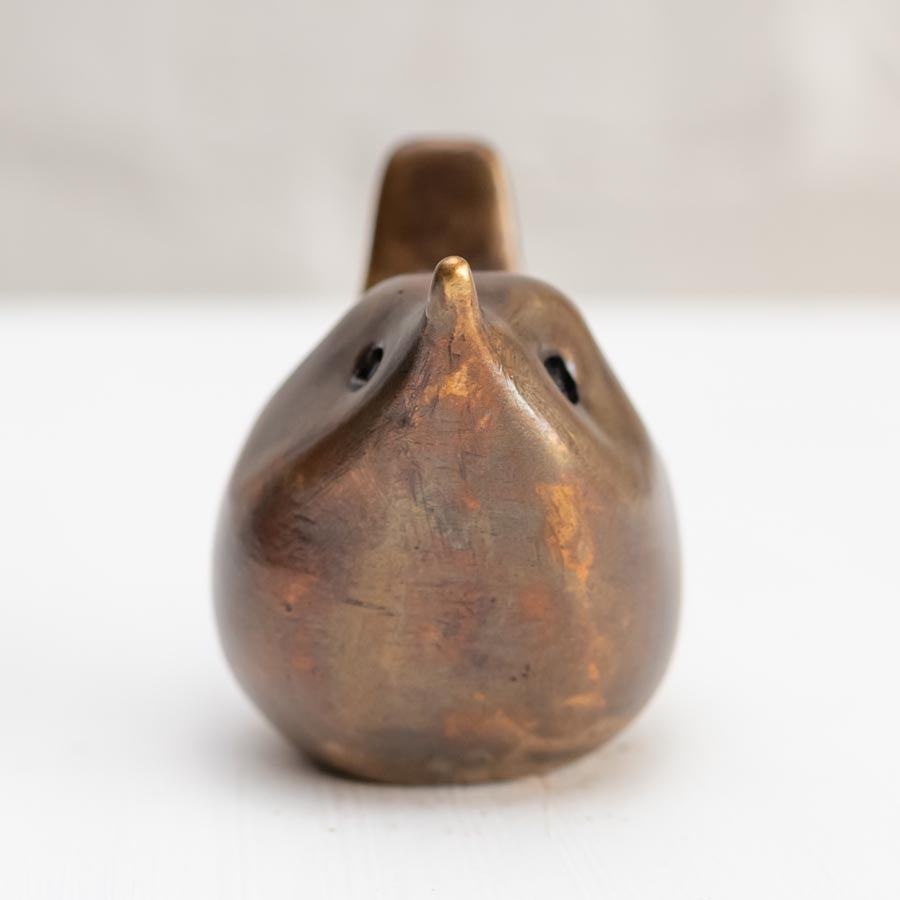 Small bronze wren sculpture against a white background - front view