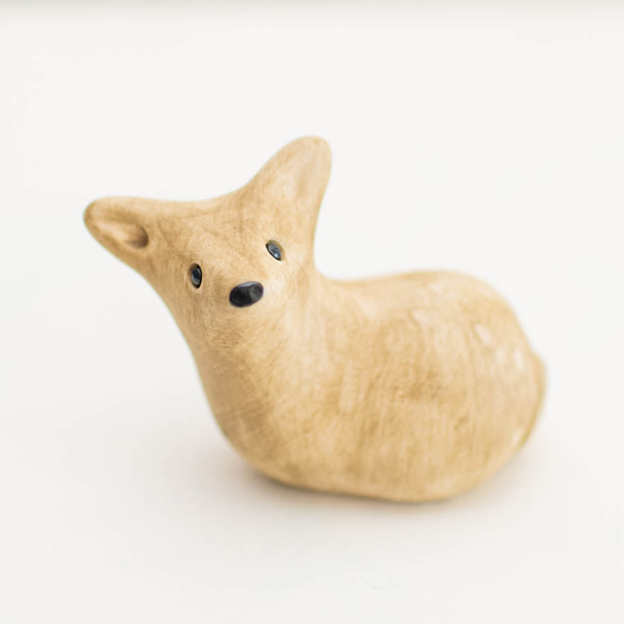 Ceramic Deer Sculpture, light brown with black eyes and nose, on a white background
