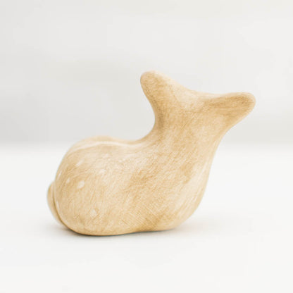 Ceramic Deer Sculpture, light brown with subtle white spots, viewed from the side on a white background