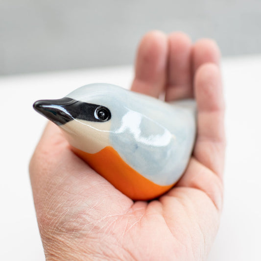 Ceramic Nuthatch Sculpture held in a hand
