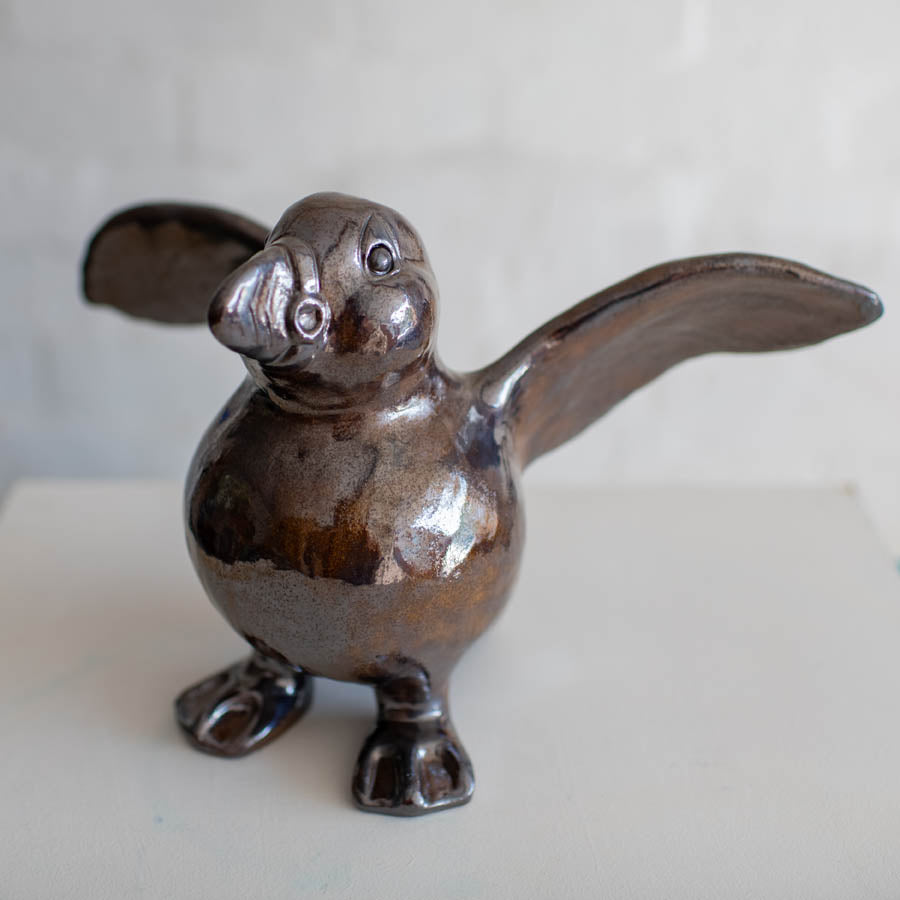 Large Ceramic Puffin Sculpture, dark brown with outstretched wings