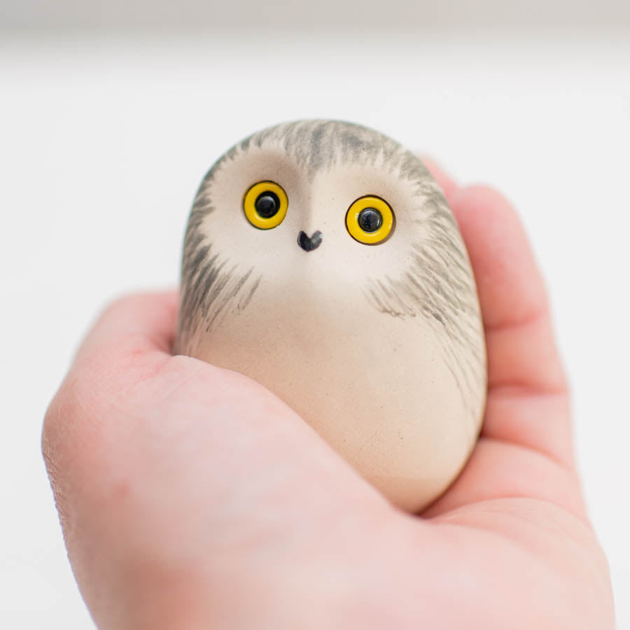 Snowy Owl Natural Finish figurine held in a hand