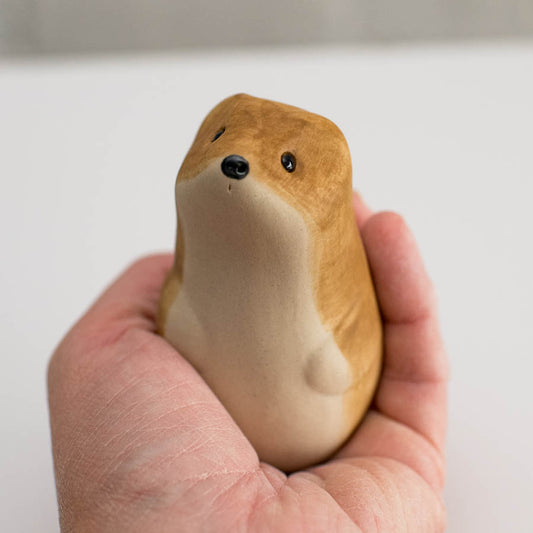 Ceramic Stoat Sculpture in a hand