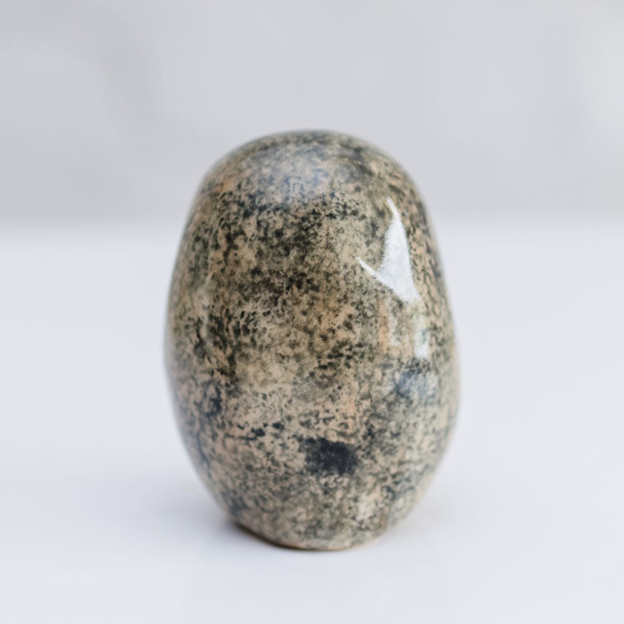 The back of the shiny small Tawny Owl sculpture