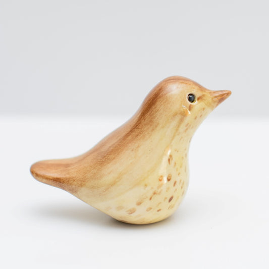 Ceramic Thrush Sculpture, a small bird figurine with brown and cream speckled feathers
