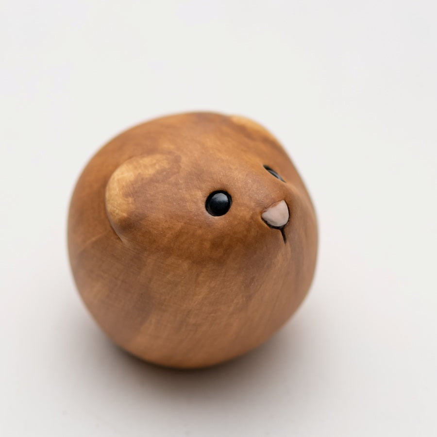 Brown Ceramic Vole sculpture on a white backgroud