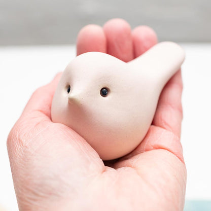 Spring Pastel Ceramic Joyful Bird held in a hand