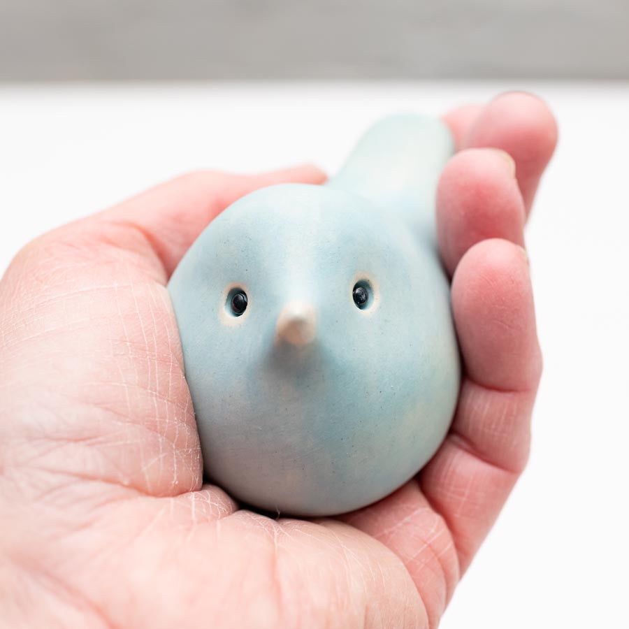 Spring Pastel Ceramic Joyful Bird held in a hand