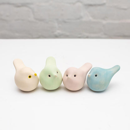 Four Spring Pastel Ceramic Joyful Birds in a row, light yellow, light green, light pink, and light blue