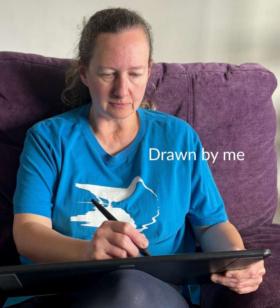 Sarah Brabbin sat on a purple sofa drawing on a tablet