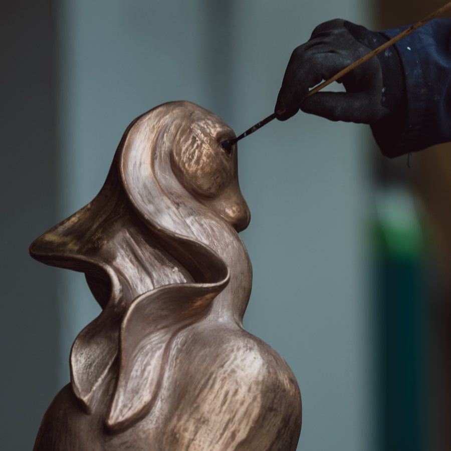 Bronze hare having patina applied with a paintbrush