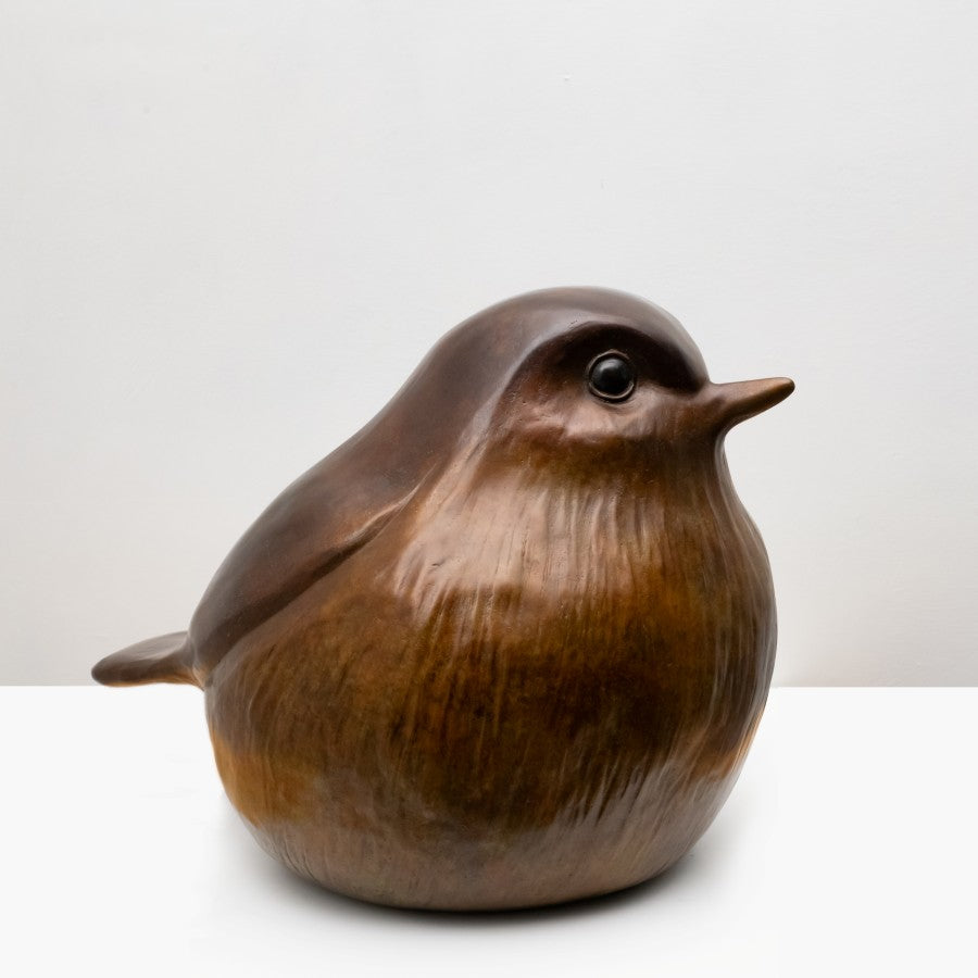 The front view of a large bronze Robin sculpture