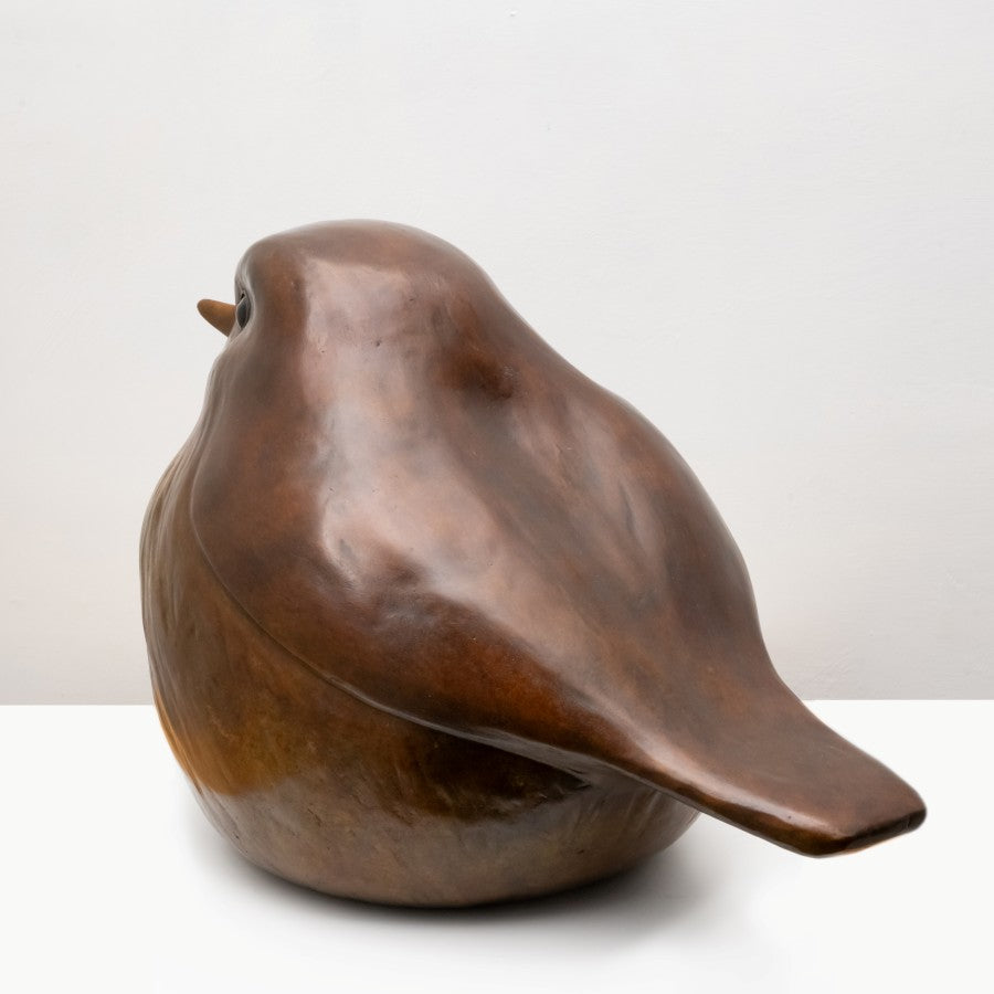Large bronze Robin sculpture left rear view against a white background