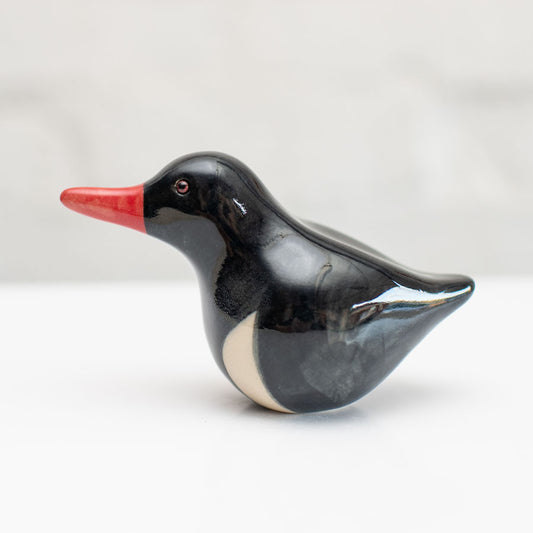 Small ceramic Oystercatcher Sculpture  against a white background