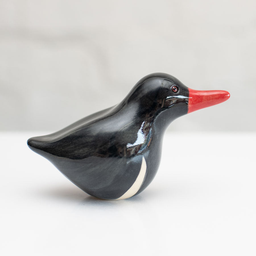 Small ceramic Oystercatcher Sculpture  against a white background
