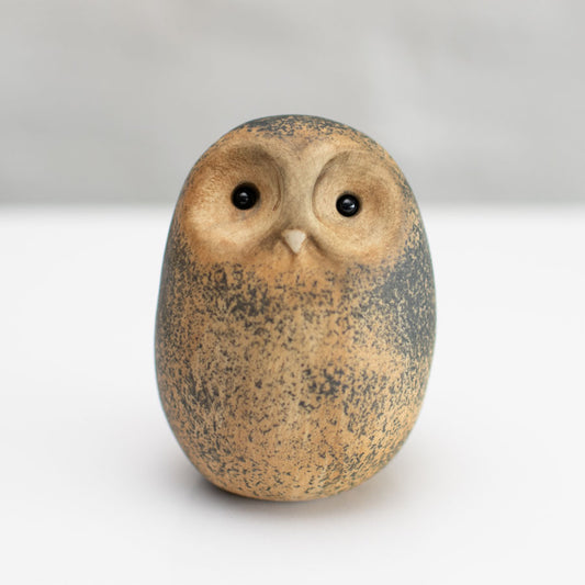 Small ceramic Tawny Owl sculpture against a white background