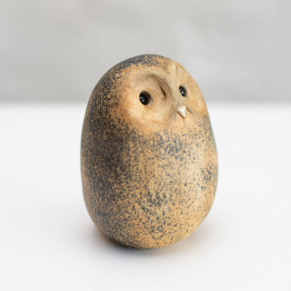 Small ceramic Tawny Owl sculpture against a white background
