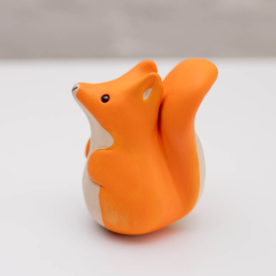 Small ceramic red squirrel sculpture