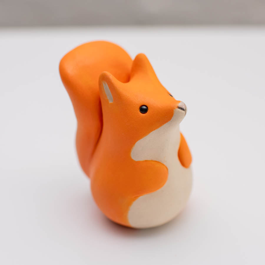 Small ceramic red squirrel sculpture