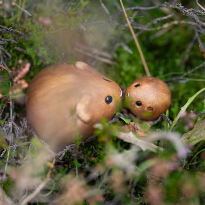 Ceramic Vole Sculpture Set in a natural outdoor setting with moss and small plants