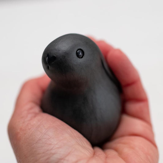 Small Ceramic Bunny Rabbit - Matt Black Melanie held in a hand