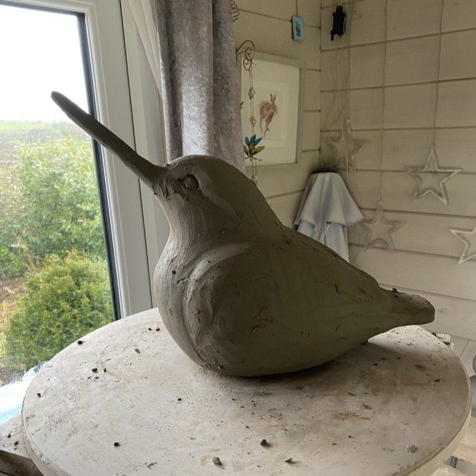 Kingfisher sculpture in progress during the clay sculpting phase