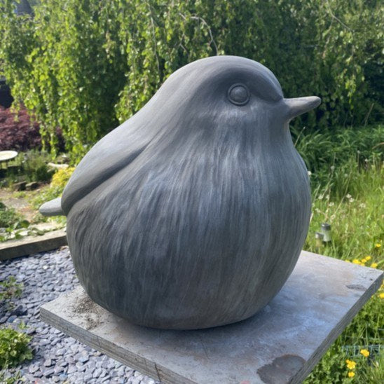 Large Robin sculpture in clay in the garden before being taken to the foundry