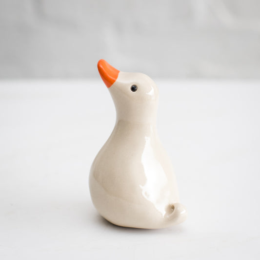 white ceramic duck