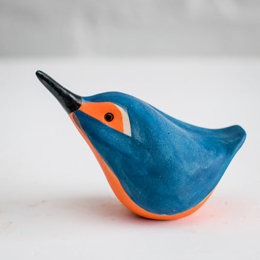 A small stylised ceramic Kingfisher in bright blue and orange colours