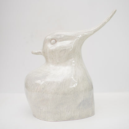 Ceramic lapwing sculpture in a metallic white glaze.