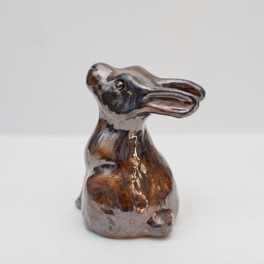 ceramic leveret sculpture in a shiny metallic glaze