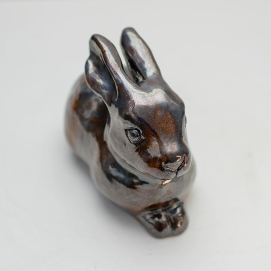 A sweet ceramic Leveret sculpture in a metallic brown glaze