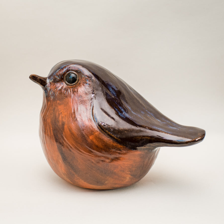 Ceramic robin with a glossy brown and orange glaze